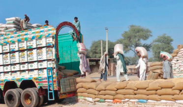 TRUCK LOADED WITH FLOUR WORKERS ON DUTY